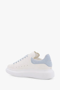 Alexander McQueen women’s Larry low top leather sneakers in white with light blue suede heel tab and matching laces