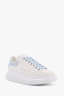 Alexander McQueen women’s Larry low top leather sneaker in white with light blue suede accents and chunky sole