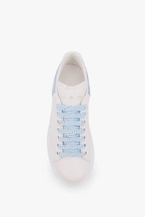 Alexander McQueen women’s Larry low top leather sneaker in white with light blue laces and matching side panels