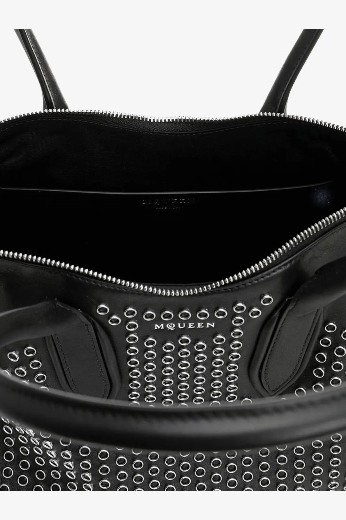 Alexander McQueen women’s manta black leather tote bag with silver-toned circular studs in a grid pattern