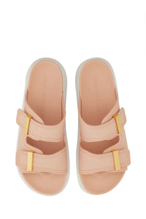 Pink leather slide sandals with gold-tone buckle straps and white rubber sole for women by Alexander McQueen
