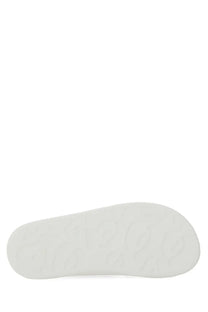 White rubber sole with embossed logo pattern on alexander mcqueen women’s oversize hybrid sandal blue