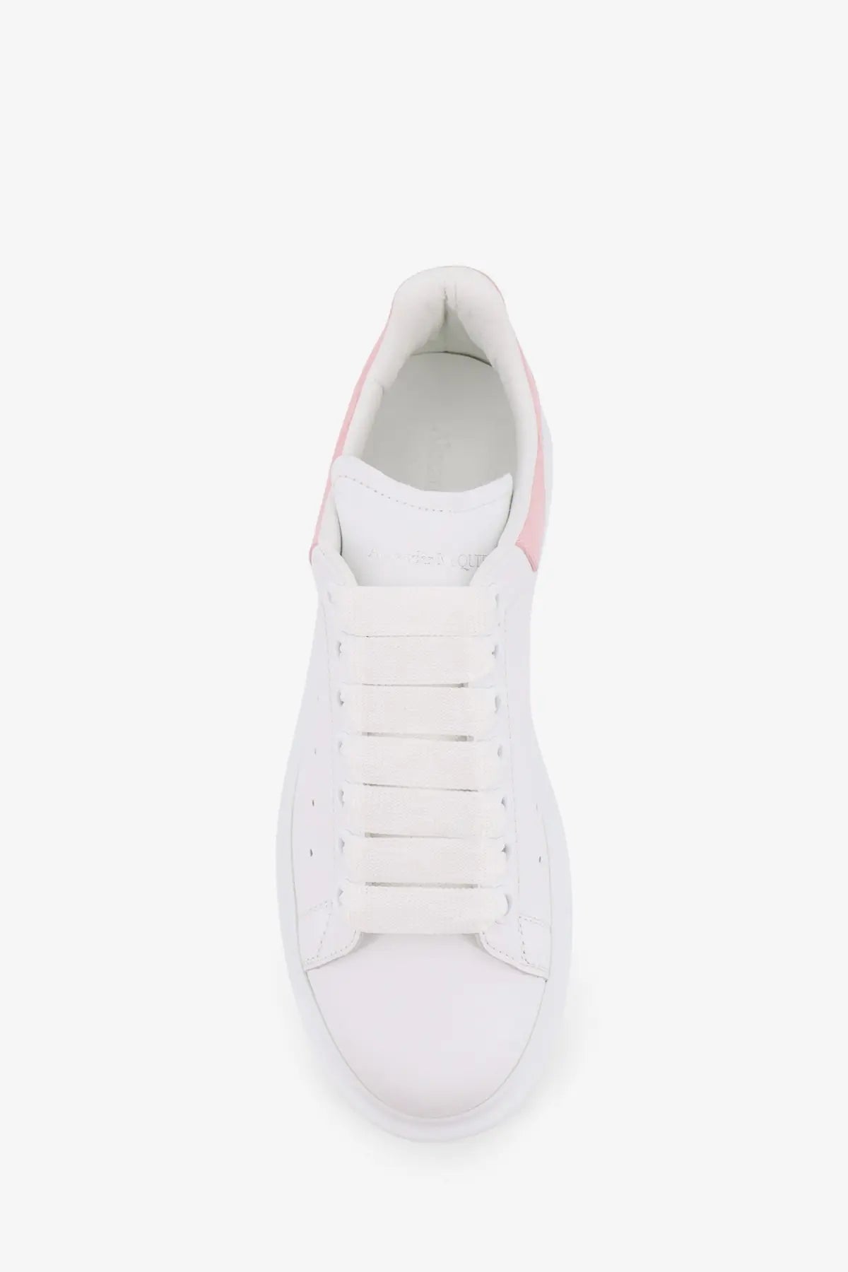 Alexander McQueen women’s oversize leather sneakers in white with pink accents and a minimalist design