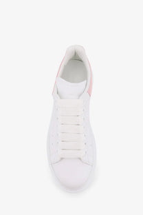 Alexander McQueen women’s oversize leather sneakers in white with pink accents and a minimalist design