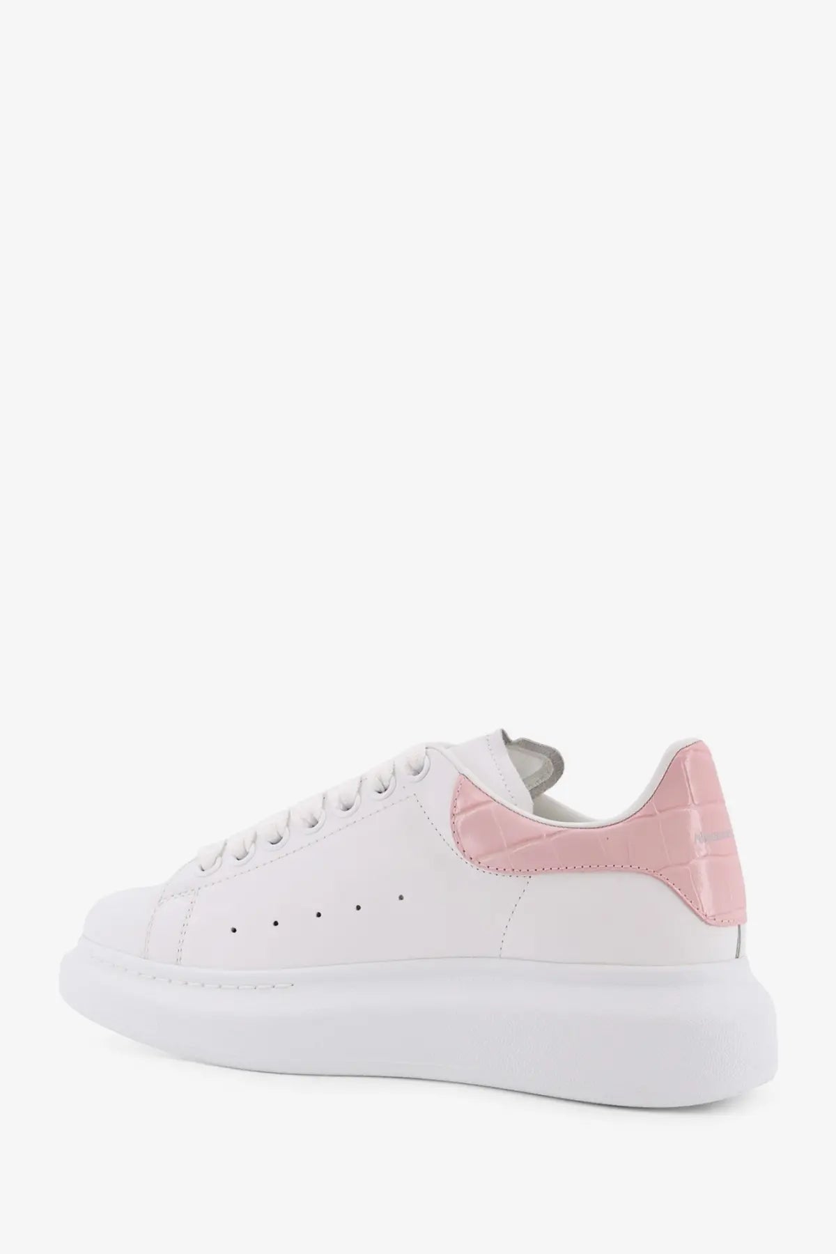 White alexander mcqueen women’s oversize leather sneaker with pink croc embossed heel tab and thick white sole back view