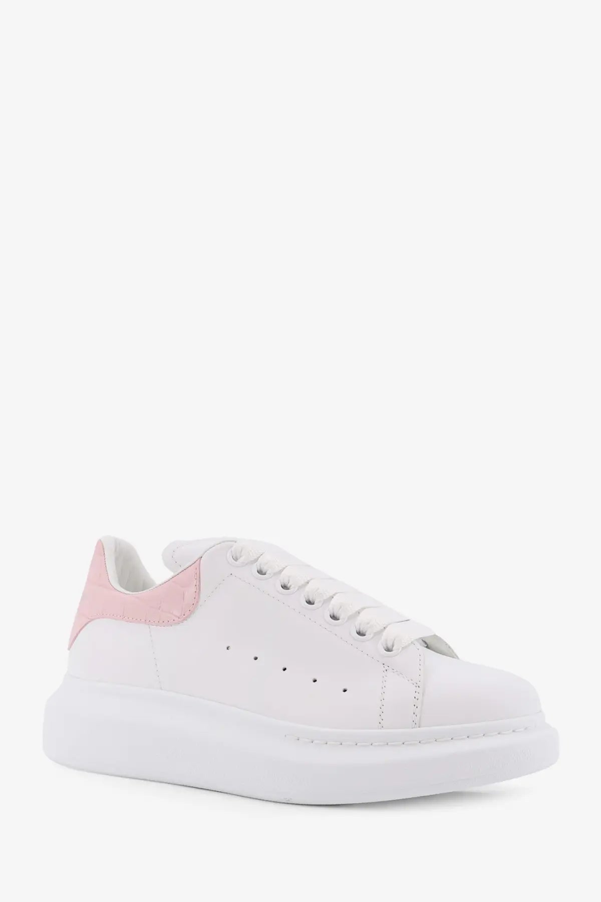 White leather alexander mcqueen women’s oversize sneaker with pink suede heel tab and chunky white sole back view