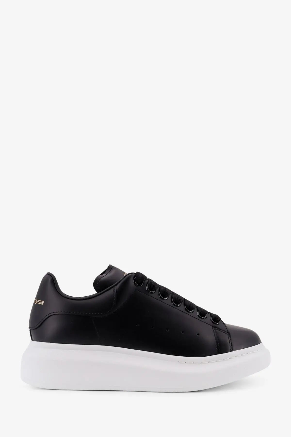 Black leather alexander mcqueen women’s oversized sneaker with thick white rubber sole and black laces