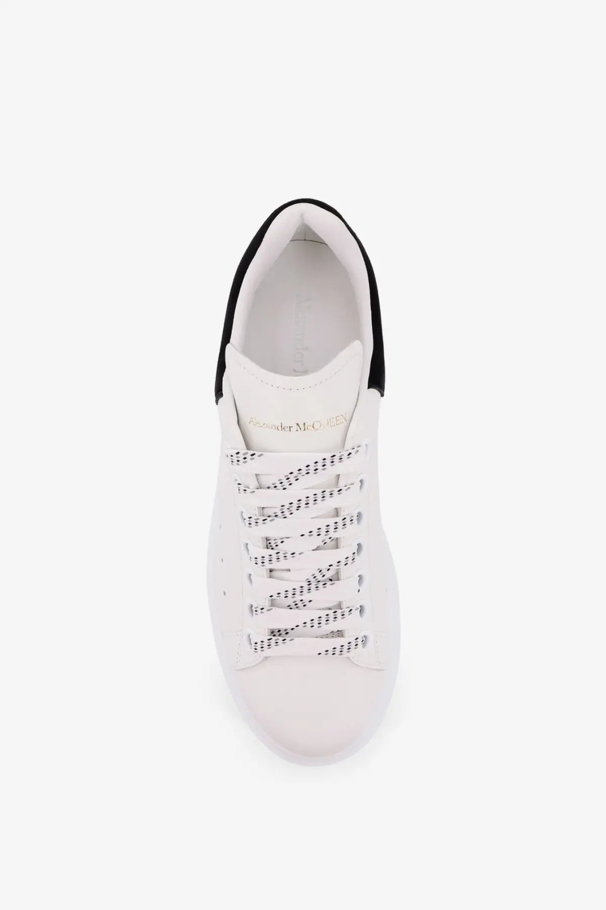 Alexander McQueen women’s oversized leather sneakers in white with black accents and perforated laces