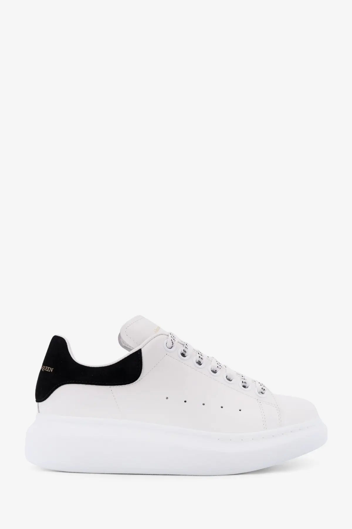 Alexander McQueen women’s oversized leather sneakers in white with black heel tab and chunky sole shown from back