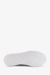 White rubber sole with embossed leopard print pattern on alexander mcqueen women’s oversized black leather sneakers