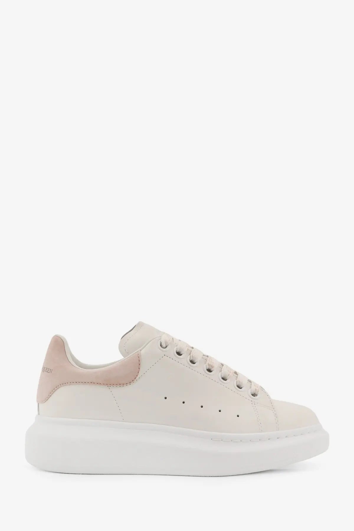 Alexander McQueen women’s oversized cream leather sneaker with thick white sole and pink heel tab accents back view