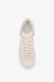 Alexander McQueen women’s cream suede oversized sneaker with pink accents on heel and tongue minimalist design