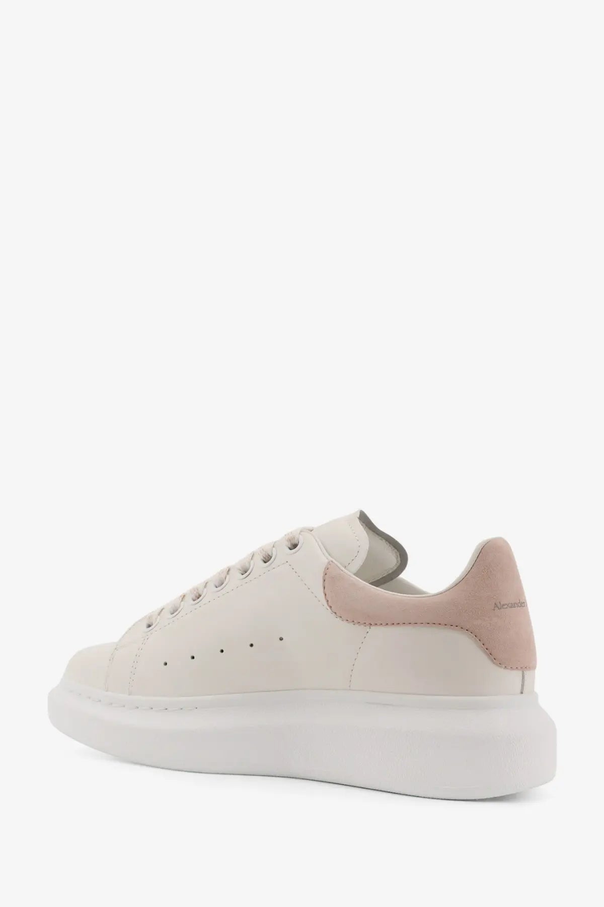 Alexander McQueen women’s oversized leather sneaker in cream with pale pink suede heel tab and thick white rubber sole back view