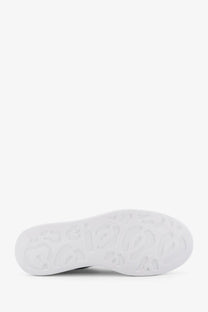 White rubber sole with embossed logo pattern on alexander mcqueen women’s oversized leather sneakers white