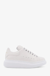 Alexander McQueen women’s oversized white leather sneakers with chunky sole and perforated detailing