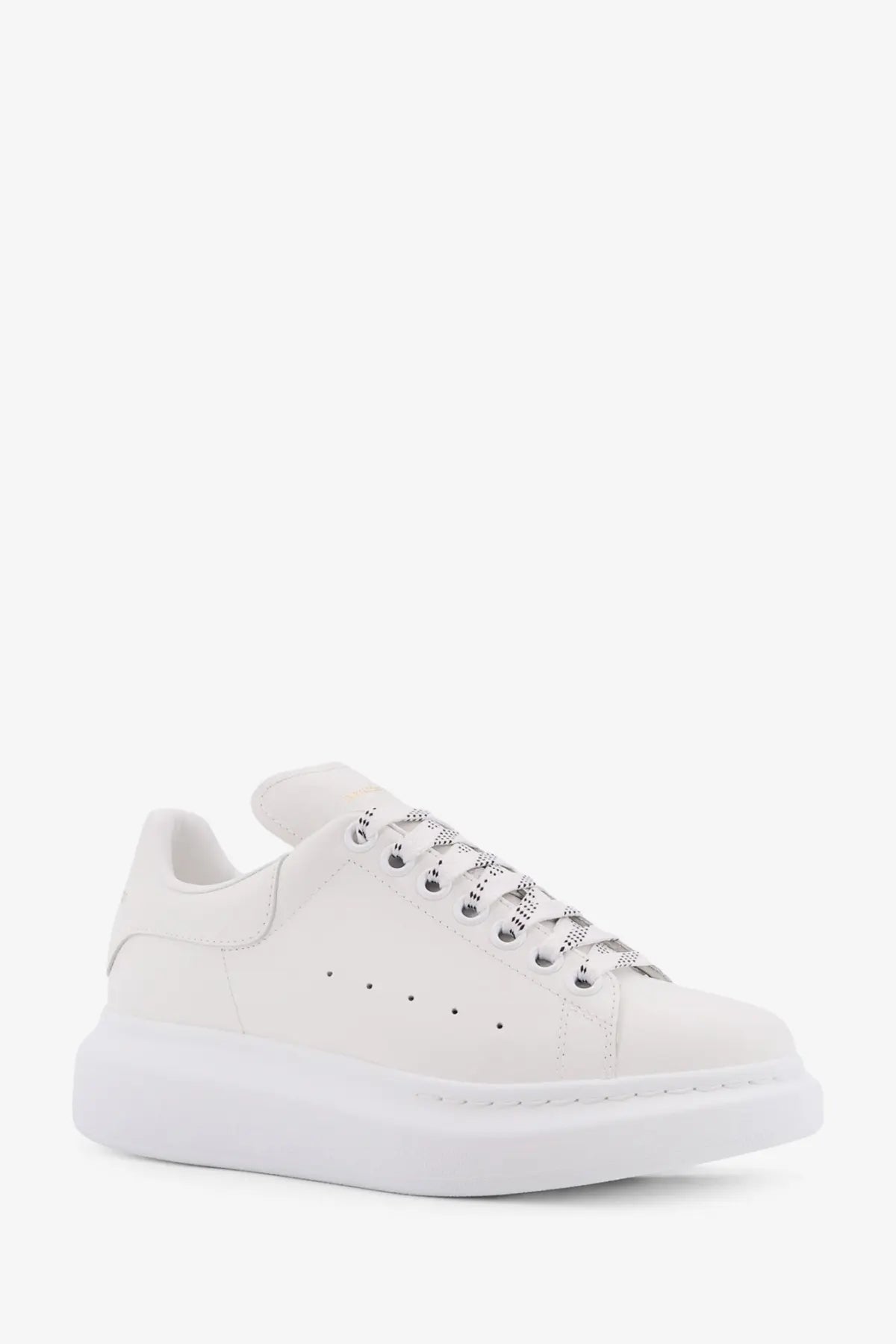 Alexander McQueen women’s oversized white leather sneakers with chunky sole and perforated detailing