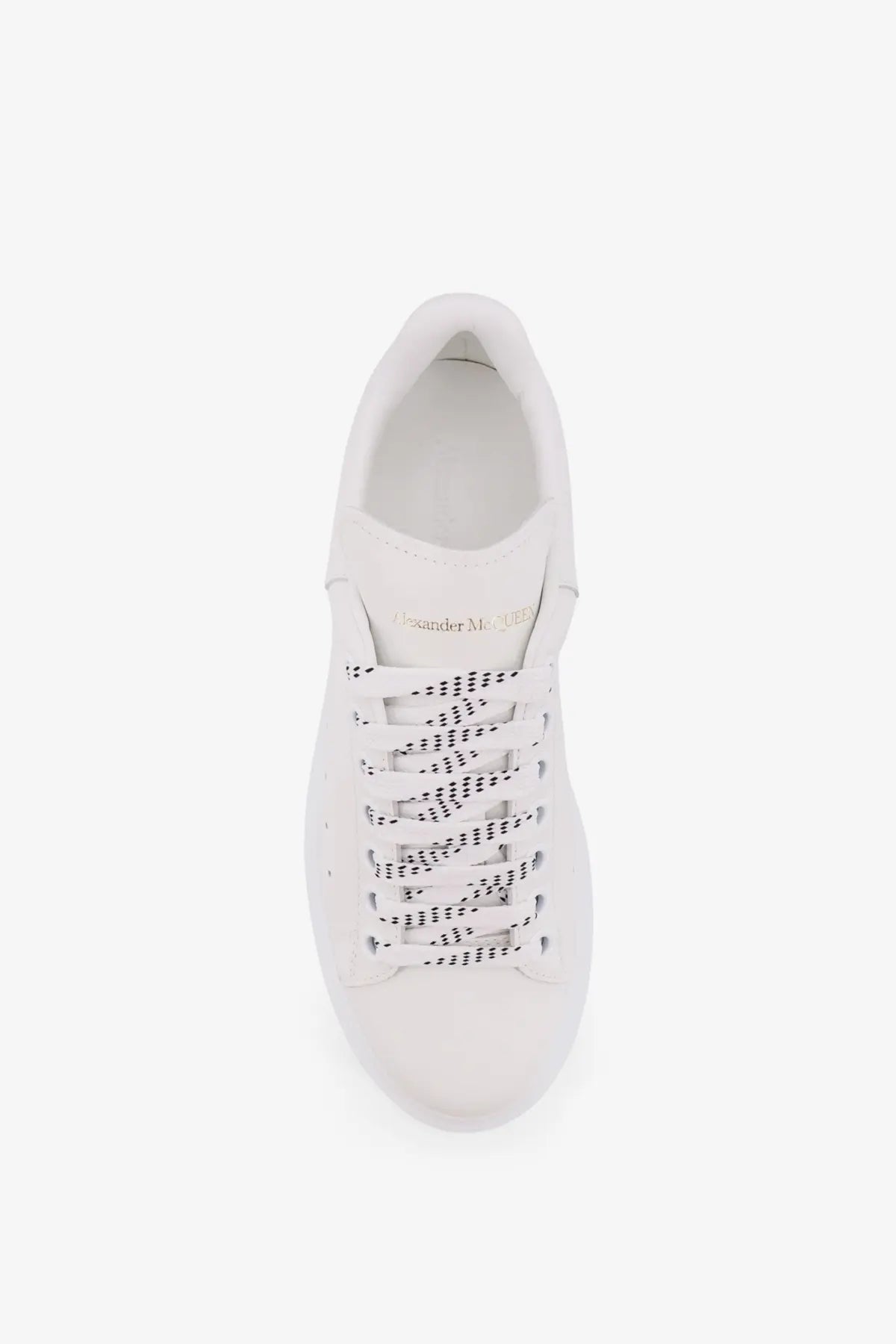 Alexander McQueen women’s oversized white leather sneaker with perforated detailing and gold branding on the tongue