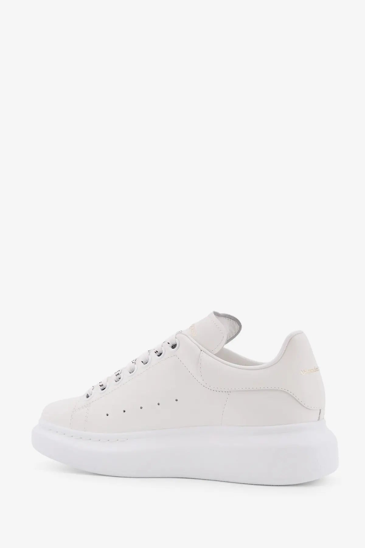 Alexander McQueen women’s oversized white leather sneakers with a chunky sole and minimalist design