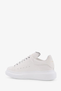 Alexander McQueen women’s oversized white leather sneakers with a chunky sole and minimalist design