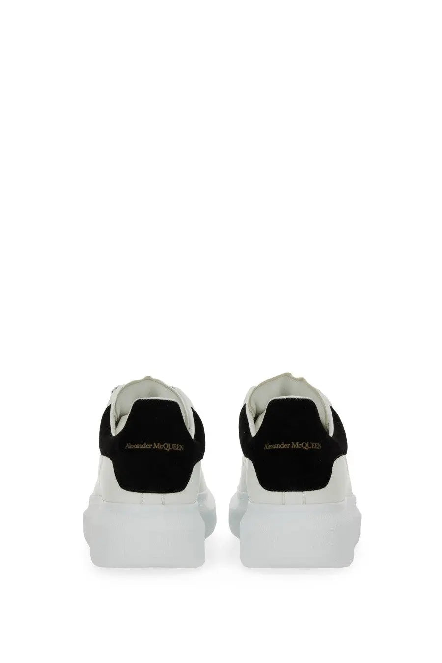 Alexander McQueen women’s oversized sneaker in white and black with chunky sole and suede detailing