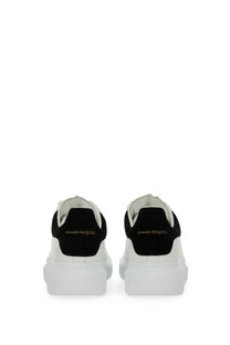 Alexander McQueen women’s oversized sneaker in white and black with chunky sole and suede detailing