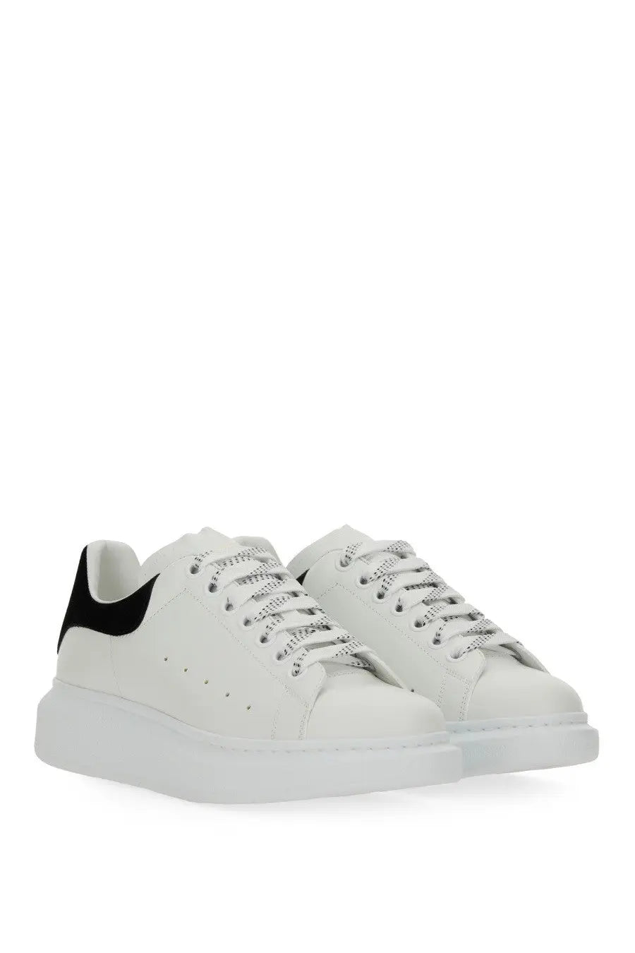 Alexander McQueen women’s oversized sneaker white in white leather with black suede heel tab and silver metallic laces