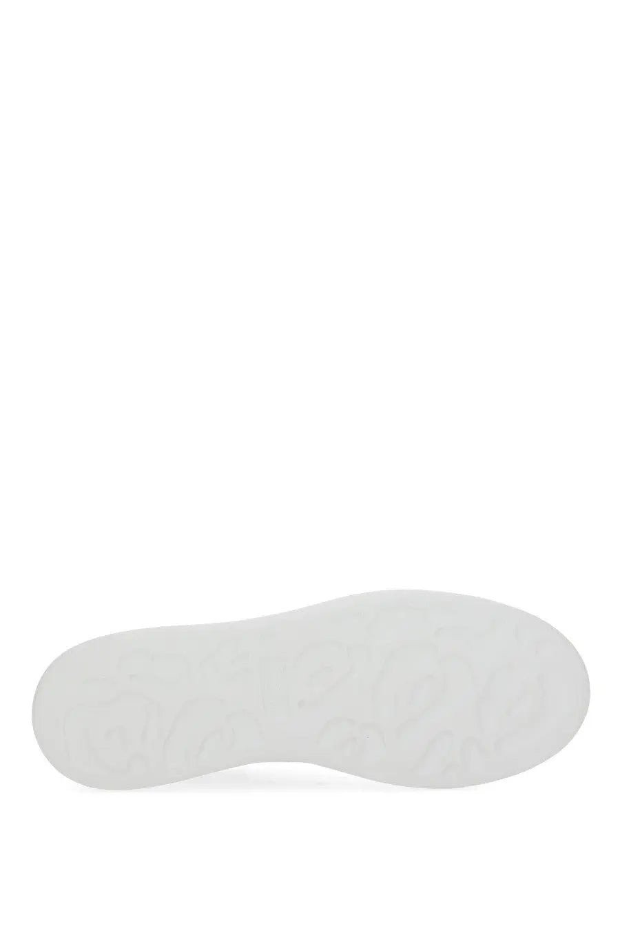 White rubber sole with subtle textured pattern on Alexander McQueen women’s oversized sneaker in white
