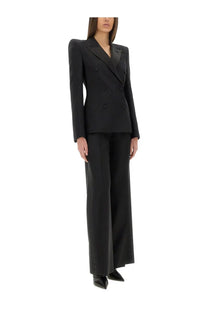 Black double-breasted blazer with structured shoulders and tailored fit paired with alexander mcqueen women’s black pants