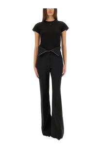 Black tailored jumpsuit with wide waistband tied into a bow at the front by Alexander McQueen women’s shirt black collection