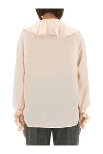 Alexander McQueen women’s blush pink blouse with flowing ruffled collar and ruched cuffs in lightweight silk-like fabric