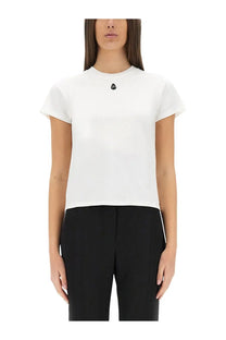 Alexander McQueen women’s white short-sleeved shirt with a small black skull emblem at the neckline