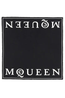 Alexander McQueen women’s black silk scarf with bold white McQueen lettering on top and bottom edges