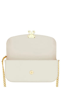 Alexander McQueen women’s small white leather crossbody bag with cream gold-tone chain strap and bunny-shaped clasp