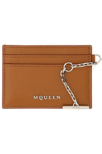 Tan leather alexander mcqueen women’s sling card holder with silver chain and mcqueen branding