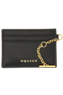 Black leather Alexander McQueen women’s sling card holder with gold-tone chain and mcqueen branding