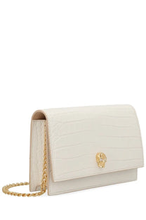 Cream-colored crocodile-embossed leather clutch with gold-tone skull clasp and chain strap Alexander McQueen small bag