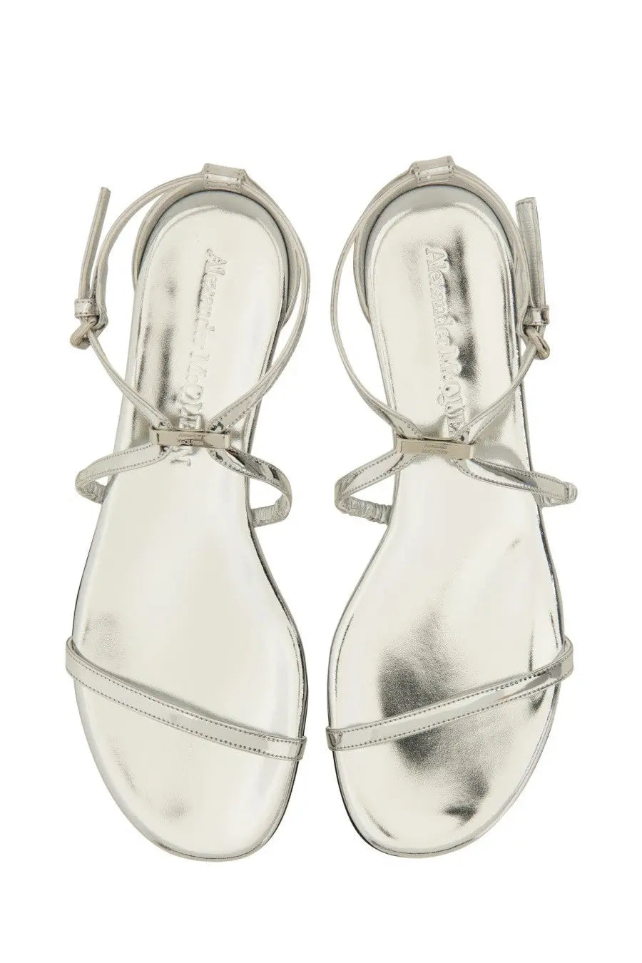 Alexander McQueen women’s silver metallic strappy sandals with sleek minimalist design and adjustable ankle straps