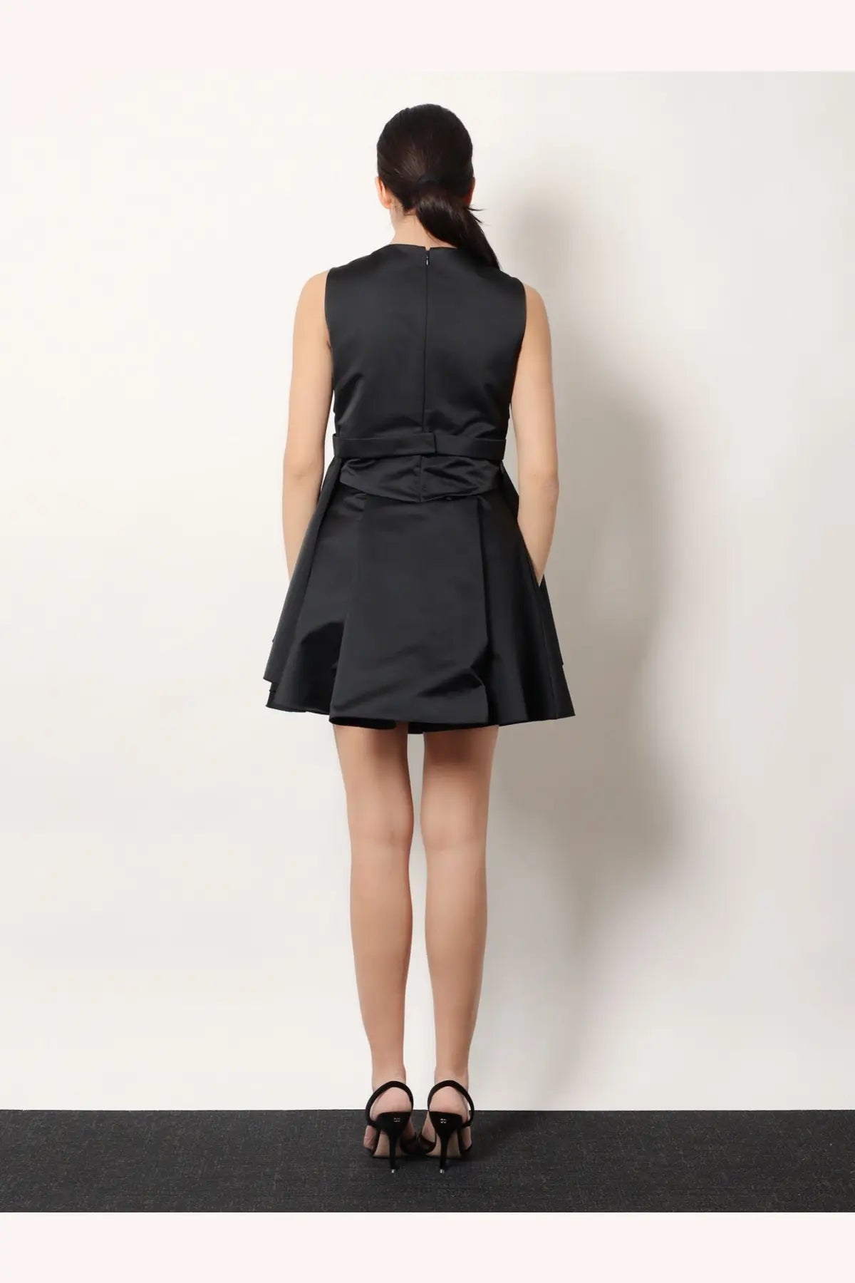 Alexander McQueen women’s black sleeveless satin taffeta dress with fitted bodice and flared skirt front view