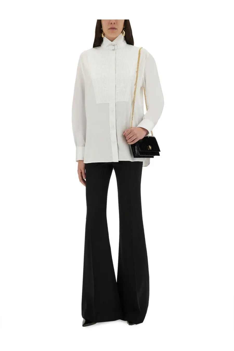 Alexander mcqueen women’s tuxedo shirt white paired with a black glossy chain-strap handbag with gold-tone hardware