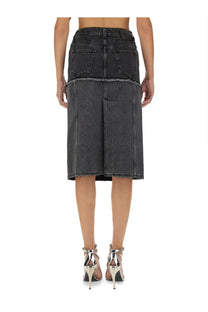 Back side of alexander mcqueen women’s black two tone dark gray denim skirt with frayed hem and two back pockets