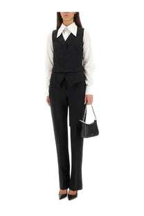 Black leather mini bag with silver chain strap shown with Alexander McQueen women’s vest corset black