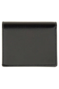 Alexander McQueen women’s wallet black leather with precise stitching along the edges for business card storage