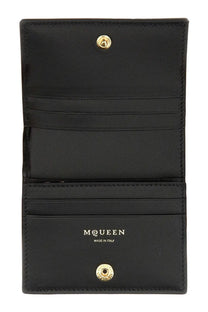 Alexander mcqueen women’s black leather wallet with gold-tone snap buttons and silver embossed logo made in italy