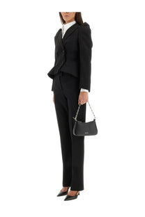 Black leather chain strap handbag with minimalist design and subtle brand logo paired with alexander mcqueen wool gabardine tailored pants black
