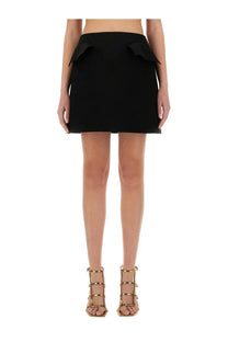 Alexander McQueen women’s black wool mini skirt with flared ruffle details at the waist