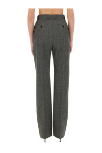 High-waisted dark gray herringbone wool blend trousers with black button accents from Alexander McQueen womens wool pants gray