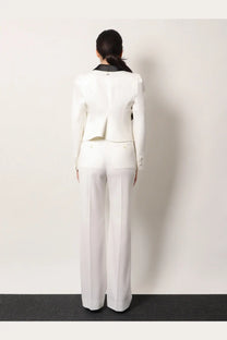 White tailored blazer with black collar and subtle back pleating paired with alexander mcqueen womens wool trousers white