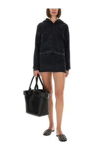Black textured leather tote bag with silver buckle and reinforced handles paired with alexanderwang women’s cotton terry sweatshirt black