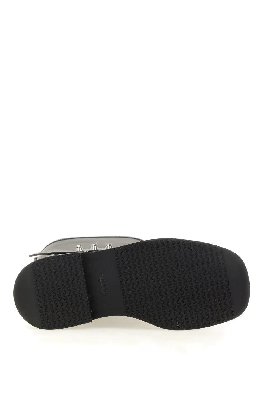Black rubber sole with textured tread pattern on the back of alexanderwang women’s dixon boot black