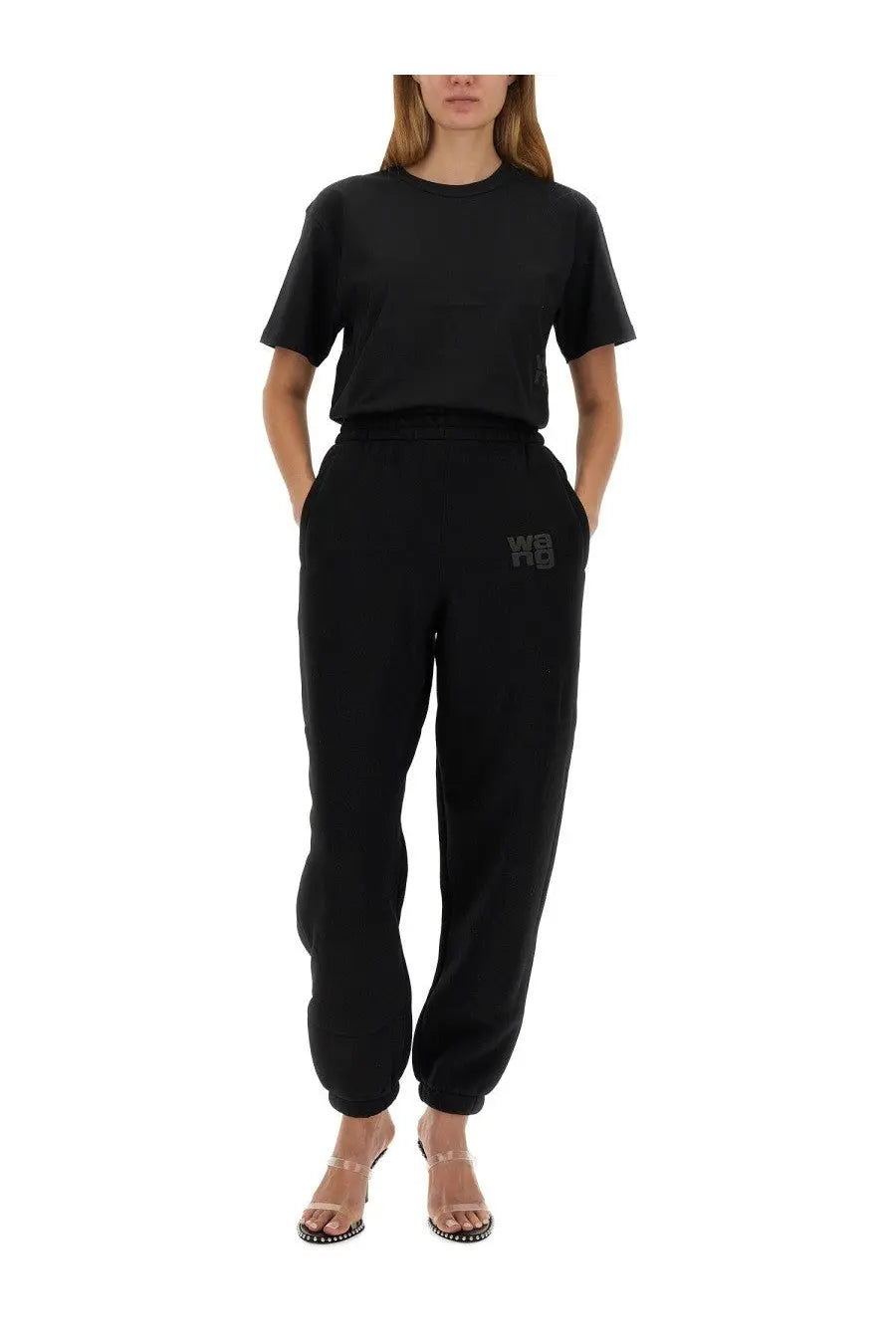 Black cotton joggers with a subtle embroidered logo on the left thigh from alexanderwang women’s essential shirt black collection
